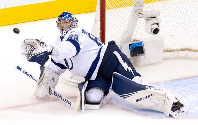 Tampa Bay Lightning goaltender Andrei Vasilevskiy picks the puck out of the air during third period against the Columbus Blue Jackets in Game 4 of the Eastern Conference first-round playoff series in Toronto on Monday. The Bolts won 2-1 to take a 3-1 series lead.