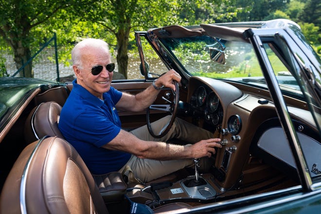 Fromer Vice President and current presumptive presidential nominee Joe Biden poses for a photo in his 1967 Corvette.