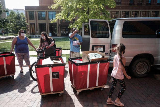 Incoming students began moving in on the OSU campus on Aug. 13, 2020 in Columbus, Ohio. All students moving into the dormitories are required to schedule a time to move in gradually with only 8 students permitted to move into a building in the same hour as an attempt to prevent spread of the coronavirus (COVID-19) among OSU students.