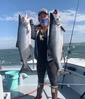 First-time angler Darien Corey of Fairfield landed two shiny king salmon weighing 20 pounds each while trolling aboard the Salty Lady during the GSSA “Fish Like a Girl” on Aug. 16. [COURTESY OF JARED DAVIS]