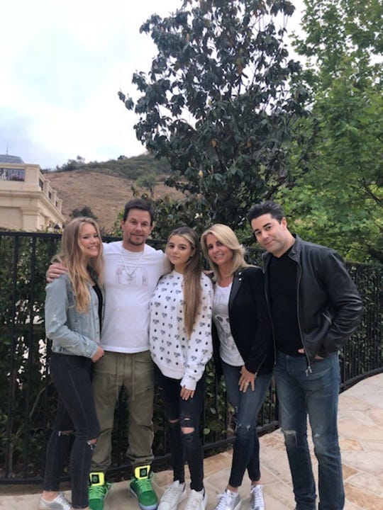 Mark Wahlberg and Jay Feldman’s daughters, Ella Rae Wahlberg and Sara Feldman, have become friends along with their dads.  The two families gathered in 2019 at Mark’s home in Beverly Hills, Calif.  L to R:  Ella Rae Wahlberg, Mark Wahlberg, Sara Feldman, Ann Feldman and Jay Feldman.