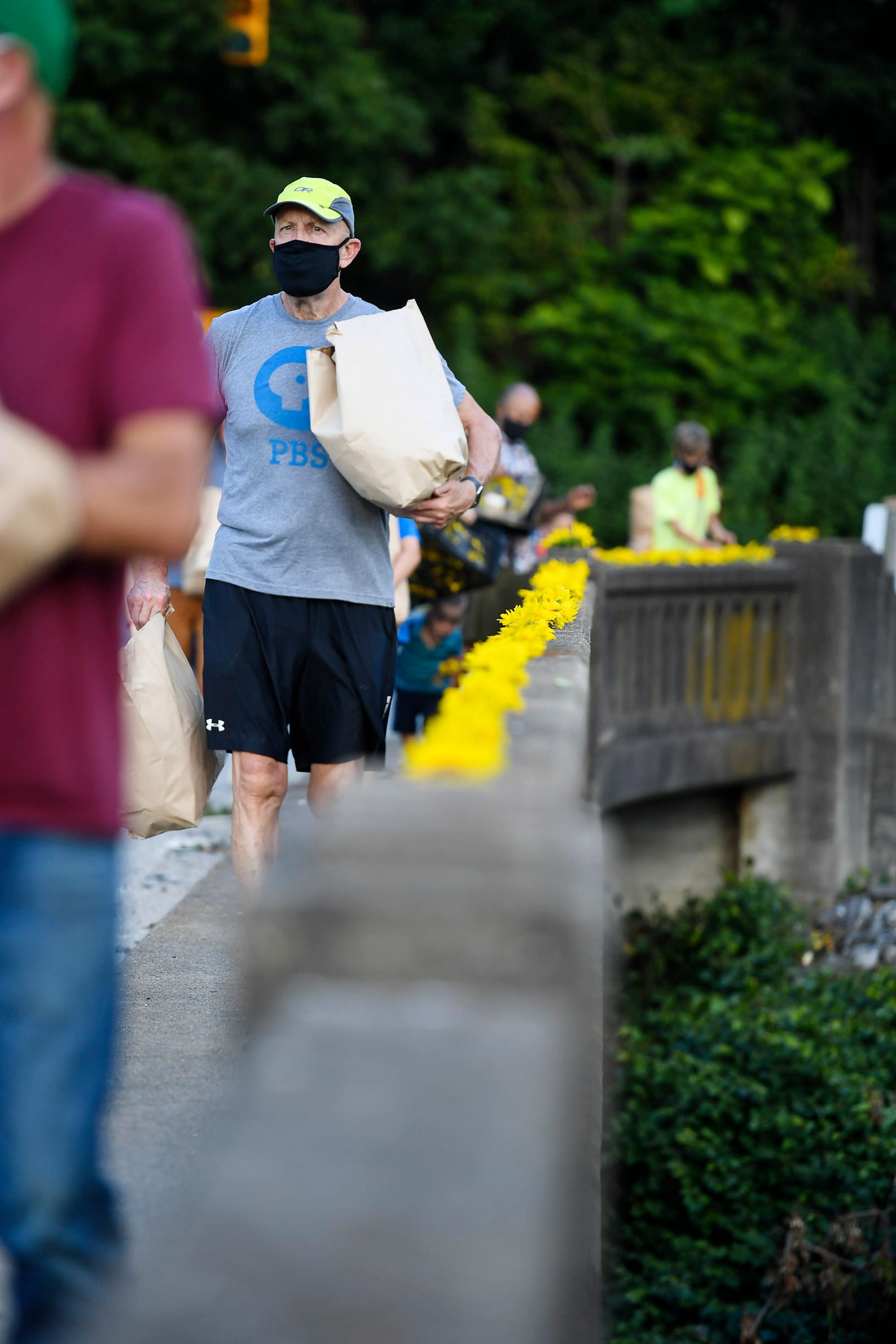 Residents of the Olivette community picked sunflowers to spread cheer across the Craggy Bridge in Woodfin August 19, 2020.