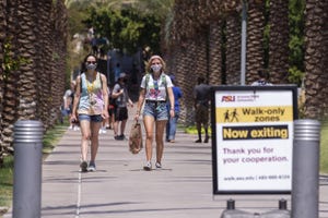 Freshmen Soledad Romero (left) and Addie Ascherl walk on campus the day before school opens on Aug. 19, 2020, at Arizona State University in Tempe.