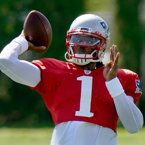 New England Patriots quarterback Cam Newton tosses