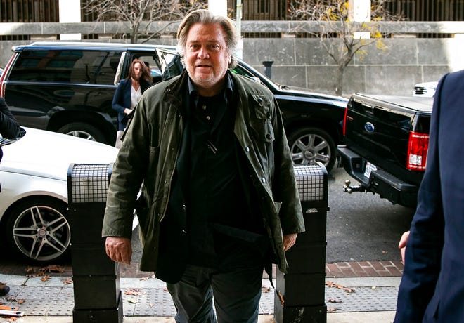 FILE - In this Nov. 8, 2019, file photo, former White House strategist Steve Bannon arrives to testify at the trial of Roger Stone, at federal court in Washington. Bannon was arrested Thursday, Aug. 20, 2020, on charges that he and three others ripped off donors to an online fundraising scheme "We Build The Wall." The charges were contained in an indictment unsealed in Manhattan federal court.  (AP Photo/Al Drago, File)