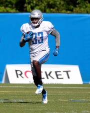 Running back Kerryon Johnson goes through drills during Detroit Lions training camp Thursday, August 20, 2020 in Allen Park. 