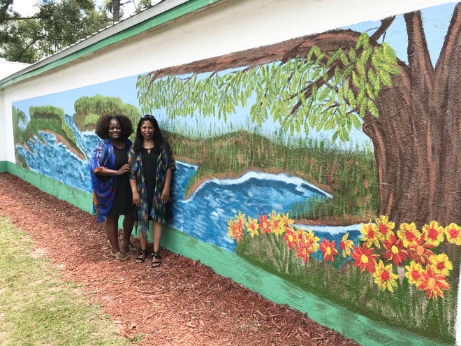 Artists Jacqueline Hatcher and Syvia Coates painted a mural at Turning Point International Church in commemoration of its 22nd Anniversary.