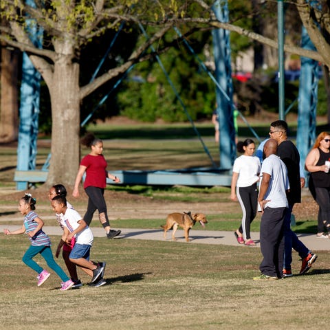People play and enjoy the weather at Coolidge Park