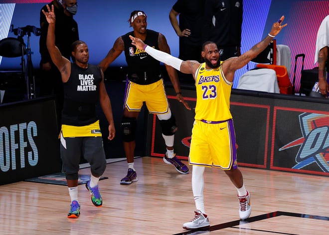 Los Angeles Lakers' LeBron James celebrates during the third quarter against the Portland Trail Blazers on Thursday, Aug. 20, 2020, in Lake Buena Vista, Fla.