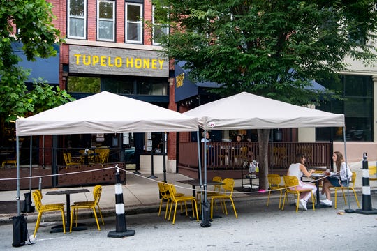 Outdoor dining for Tupelo Honey in Asheville has been expanded onto the street in front of the restaurant downtown.
