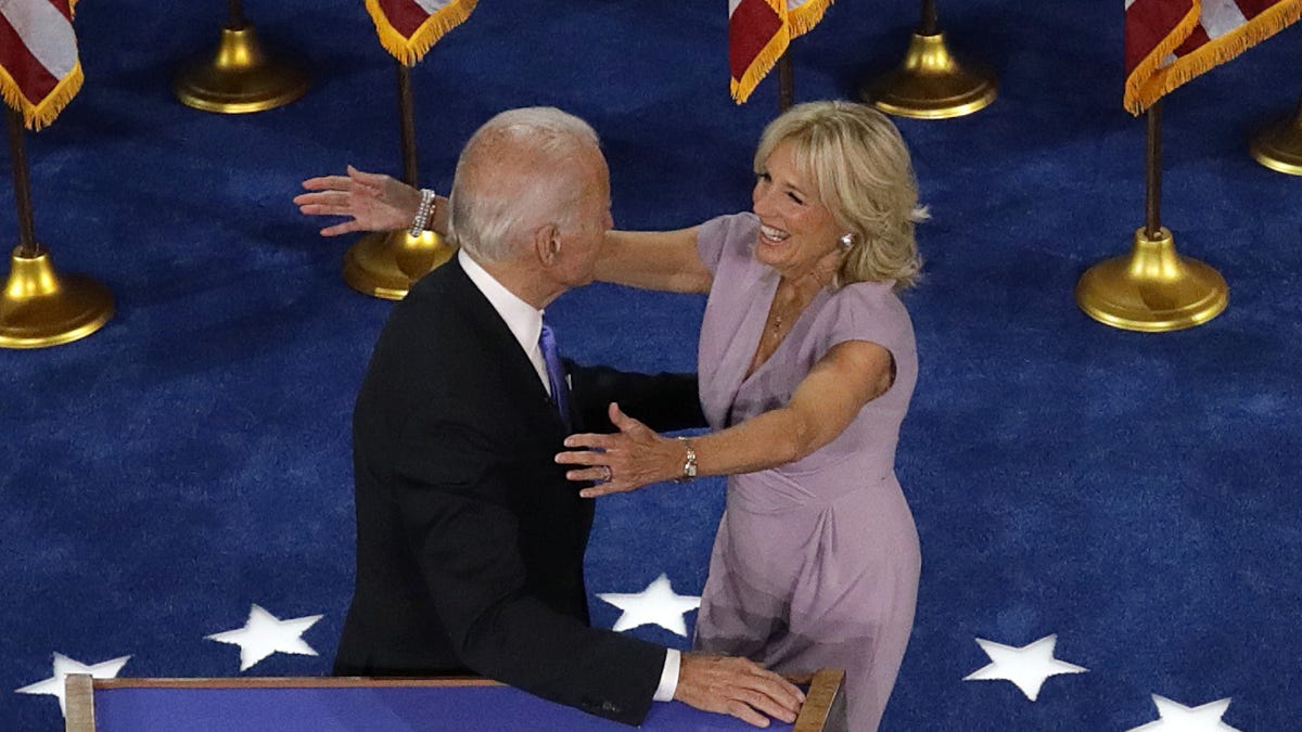 Democratic presidential nominee Joe Biden greets his wife Dr. Jill Biden on the fourth night of the Democratic National Convention from the Chase Center on August 20, 2020 in Wilmington, Delaware. The convention, which was once expected to draw 50,000 people to Milwaukee, Wisconsin, is now taking place virtually due to the coronavirus pandemic.