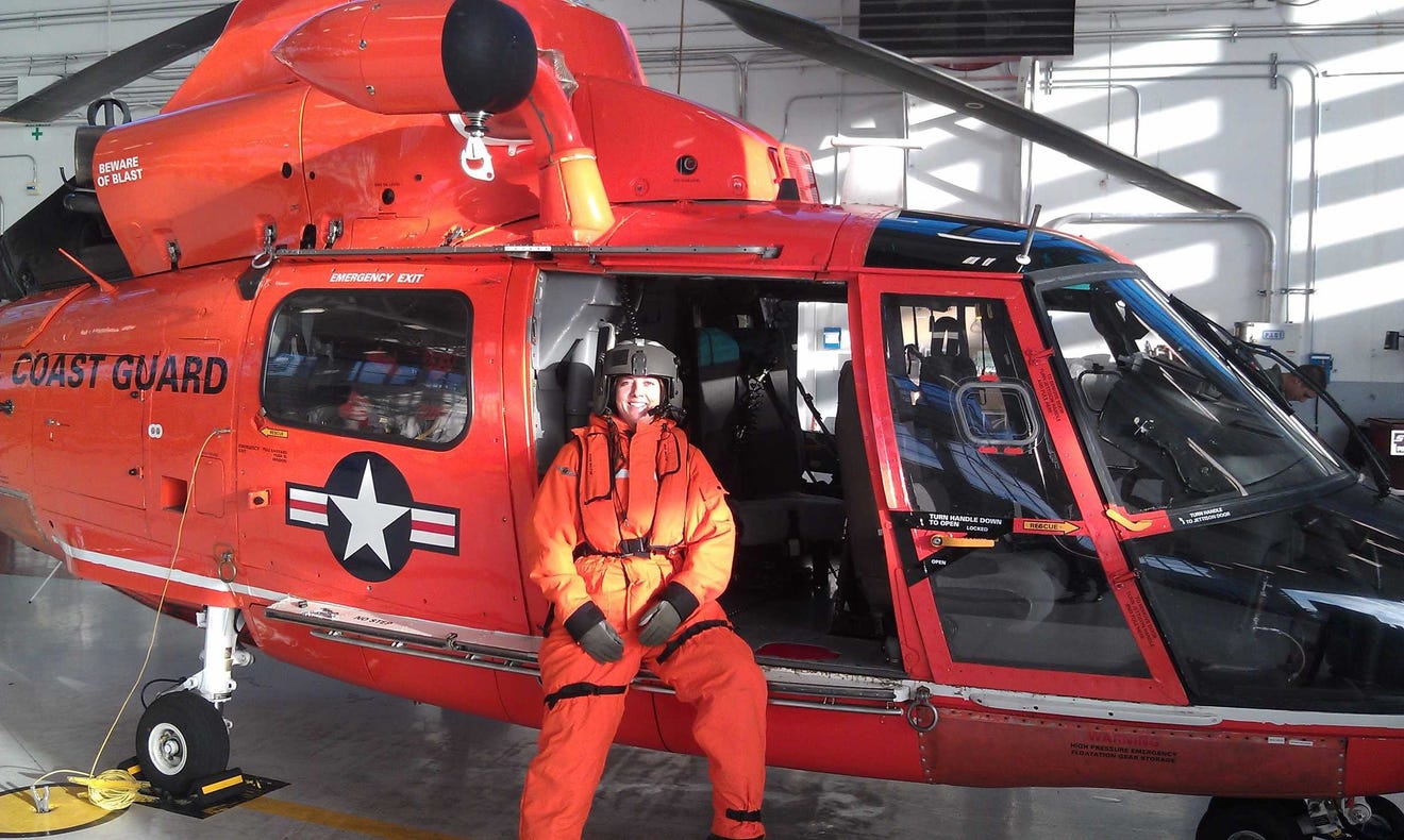 Kerry Karwan poses in a Coast Guard helicopter.