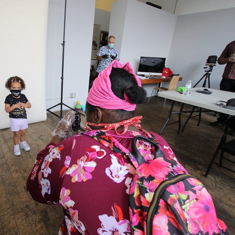 Ashley Simeon, of Newburgh, takes pictures of Auro