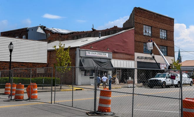 The area around the intersection of First Street and North Elm Street is blocked off following the partial collapse of the building that houses Alles Brothers, The Color Connection and the Republican headquarters Saturday, August 22, 2020.