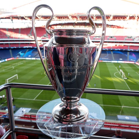 The Champions League trophy is displayed on the st