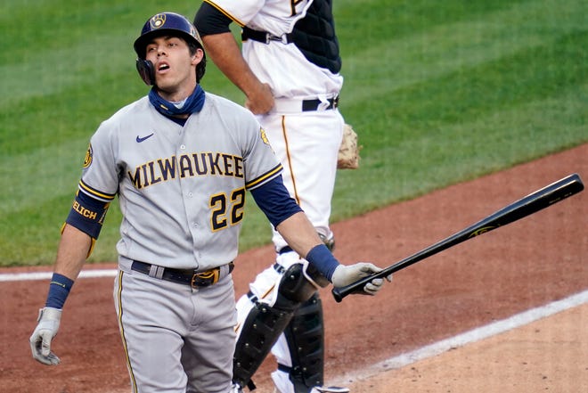 Christian Yelich strikes out in the fifth inning during the Brewers' 12-5 loss to the Pirates Saturday afternoon.