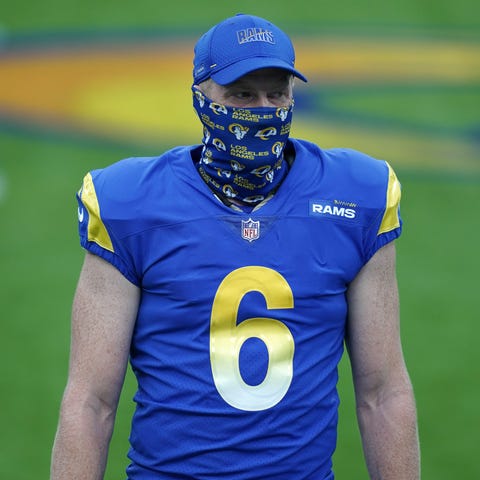 Los Angeles Rams punter Johnny Hekker wears a face
