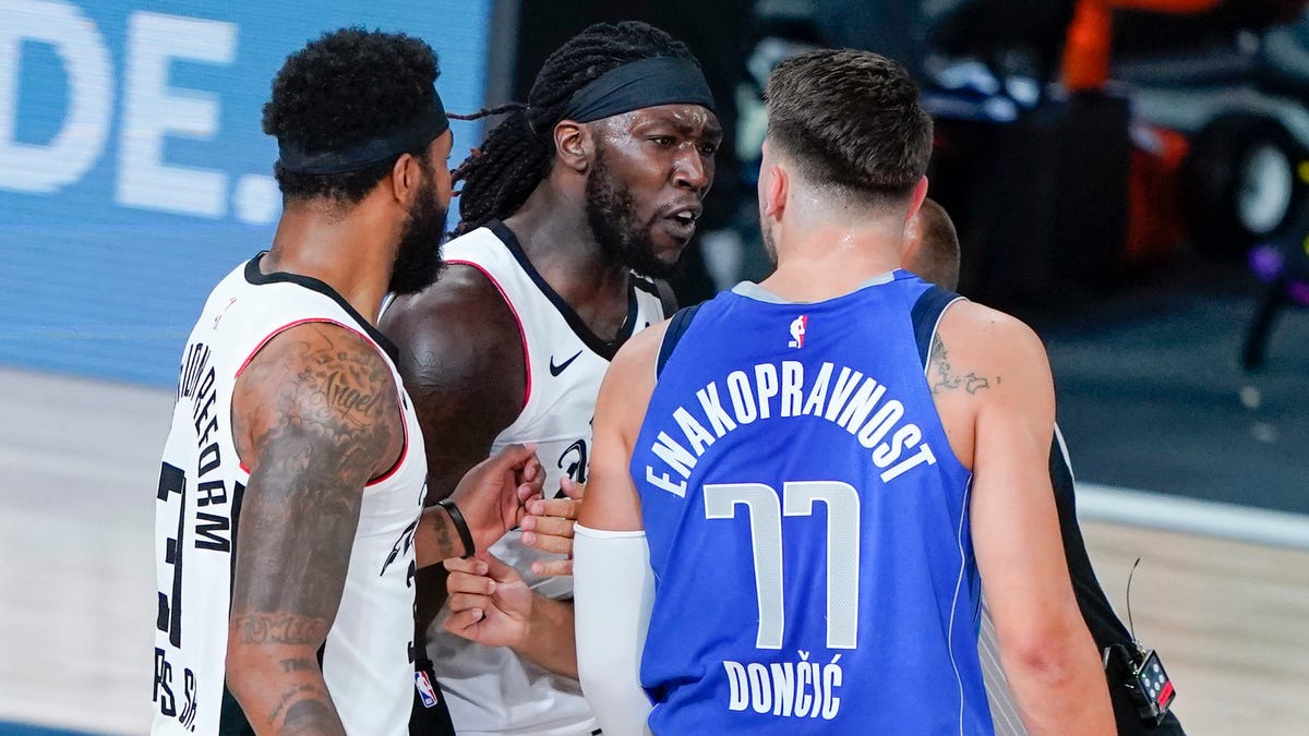 Montrezl Harrell and Luka Doncic exchange words during Game 3.