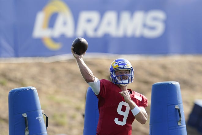 Los Angeles Rams quarterback John Wolford throws during an training camp practice Wednesday in Thousand Oaks, Calif.