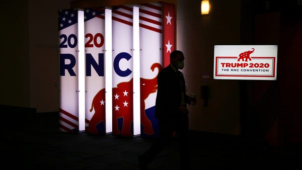 An RNC sign glows outside the Charlotte Convention