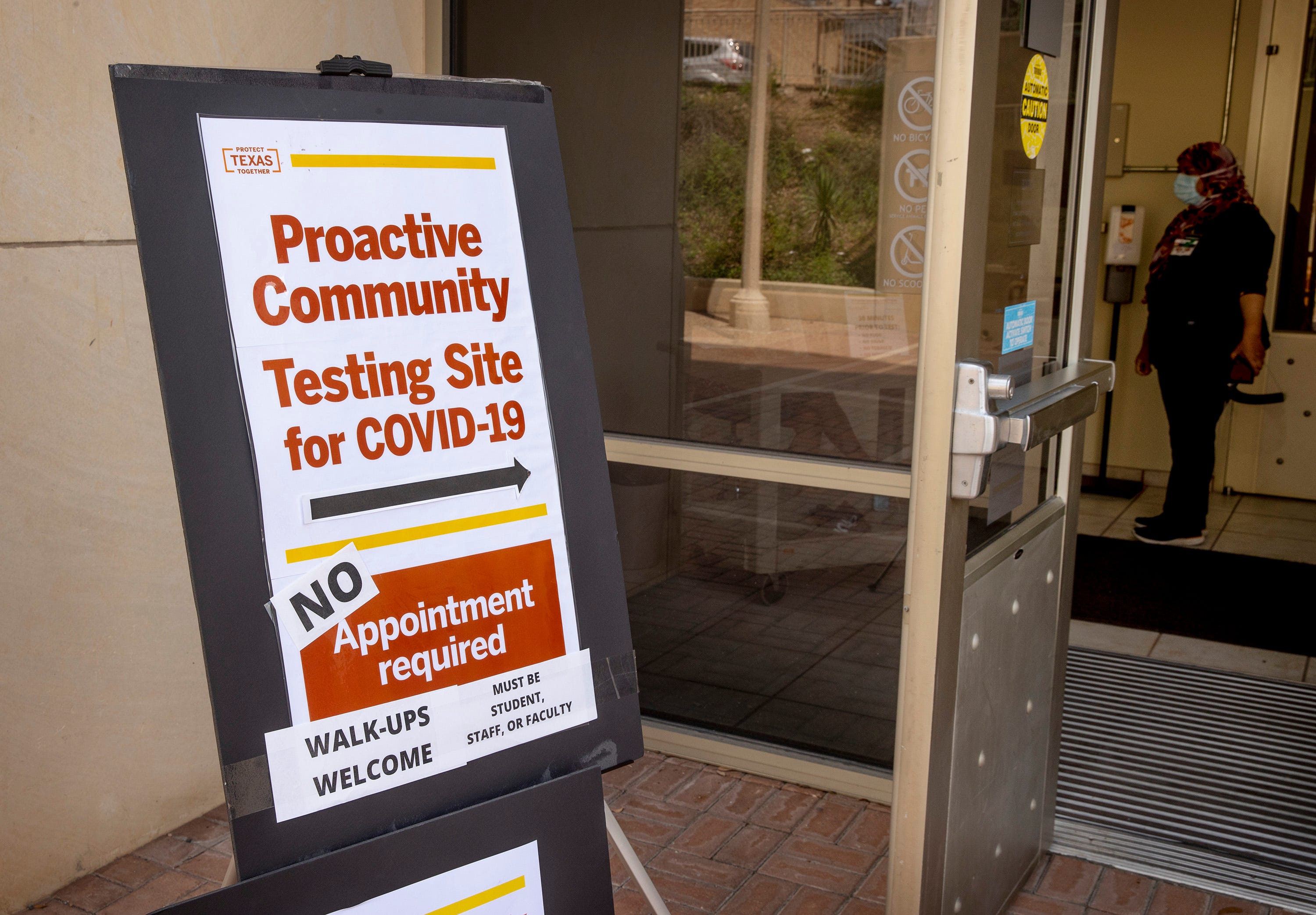 A sign directs people to a COVID-19 testing site at the Student Services Building on the University of Texas campus on Monday August 24, 2020. 