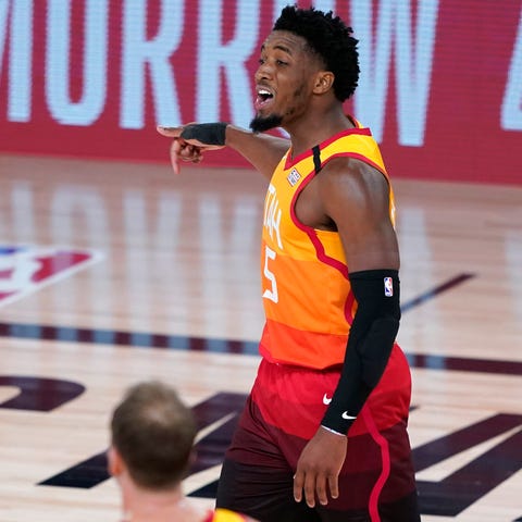 Utah Jazz guard Donovan Mitchell reacts after maki