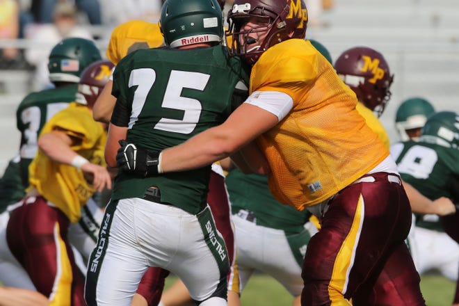 Mount Pleasant High School's Henry Lutovsky (59) blocks Ethan Eilers (75) during the first half of their scrimmage against West Burlington-Notre Dame, Saturday Aug. 24, 2019 at West Burlington.  
