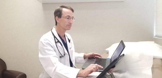 Covenant Health internist Dr. Jeff Boruff demonstrates telehealth services.