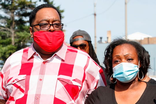 Jacob Blake, Sr., (L) and Julia Jackson, parents of Jacob Blake, Jr., arrive with family members outside of the County Courthouse for the press conference in Kenosha, Wisconsin, on August 25, 2020. - Jacob Blake, Jr., was shot several times by police may be permanently paralyzed, his family said on August 25. Blake was shot August 23 by a white policeman while getting into a car that held his three children after trying to break up a domestic dispute, according to civil rights attorney Benjamin Crump, who is representing the Blake family. (Photo by KAMIL KRZACZYNSKI / AFP) (Photo by KAMIL KRZACZYNSKI/AFP via Getty Images) ORG XMIT: 0 ORIG FILE ID: AFP_1WR0NO.jpg
