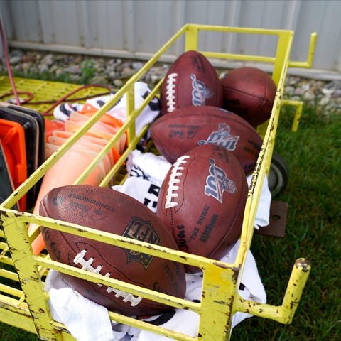 Footballs are seen during an NFL football training