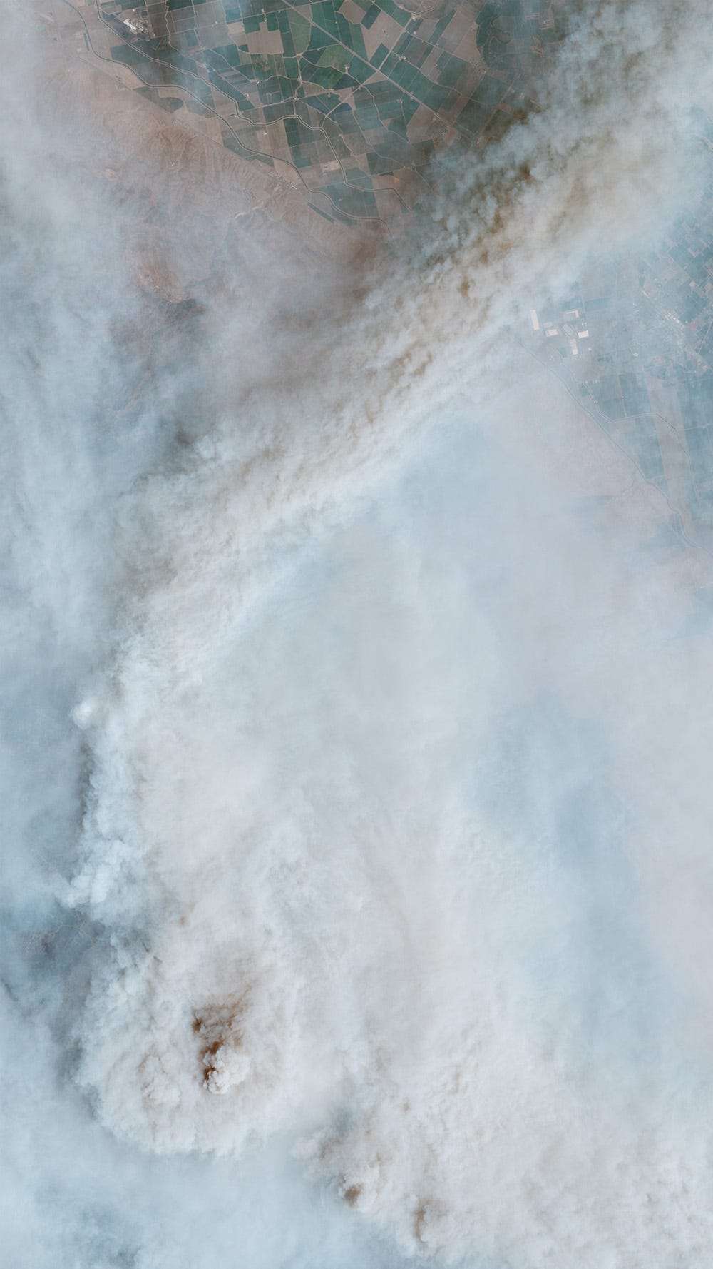 Smoke formations swirl from the SCU Lightning Complex wildfire.