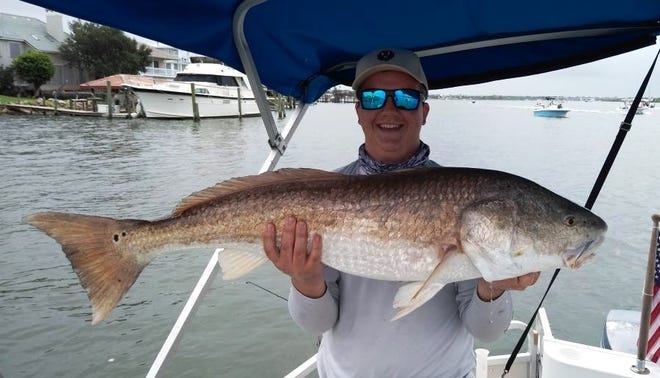 Jonathon Savino landed this 40-inch bull redfish about a half a mile south on Ponce Inlet on the Indian River.