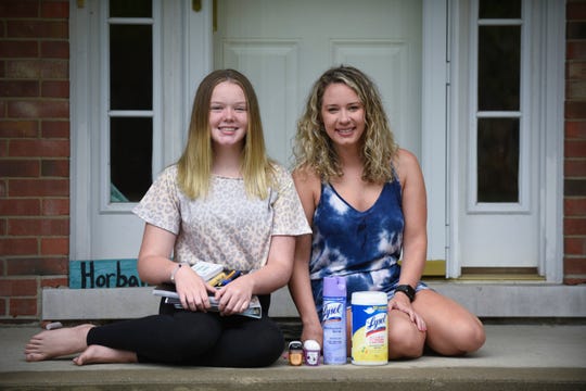 Marissa Horbal, 14, left, and her mother Kaitlyn Horbal pose for a photo at their Grosse Ile home, Wednesday, August 26, 2020. The pair said they stocked up on hand sanitizer and wet wipes as well as normal school supplies.