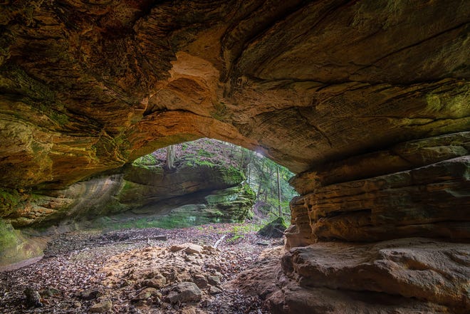 Underneath a rock formation in a parcel of land adjoining Ash Cave at Hocking Hills State Park.