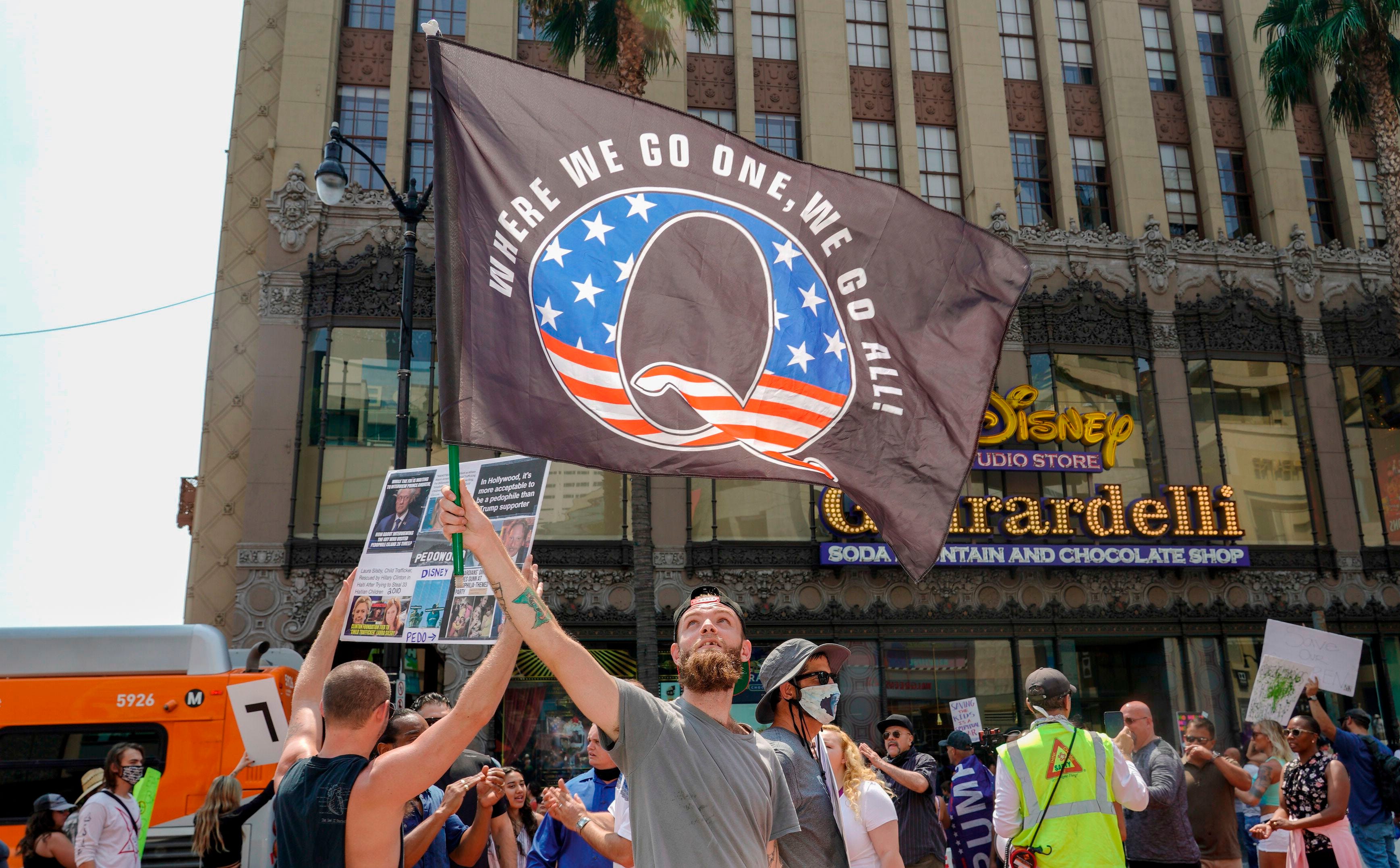 QAnon demonstrators protest on Hollywood Boulevard in Los Angeles Aug. 22.  A 2019 bulletin from the FBI warned that conspiracy-theory-driven extremists are a domestic terrorism threat.