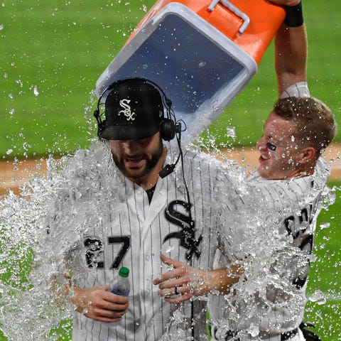 Lucas Giolito (27) doused with water after his no-