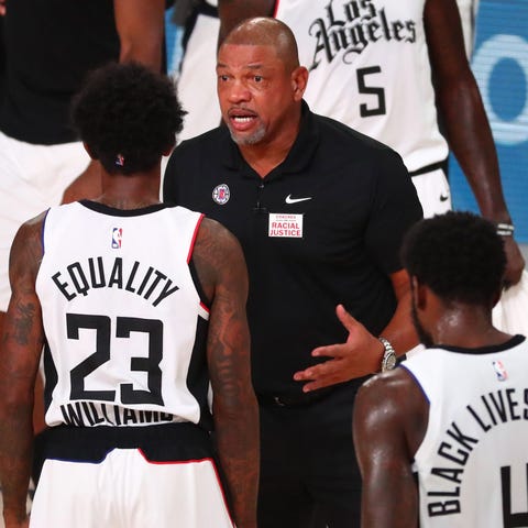 Los Angeles Clippers coach Doc Rivers talks with L