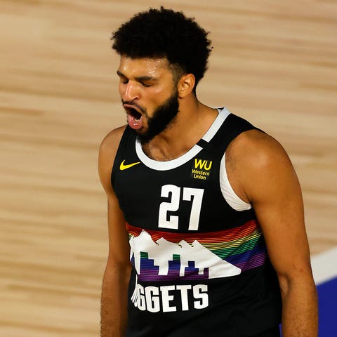 Denver Nuggets guard Jamal Murray reacts after a s
