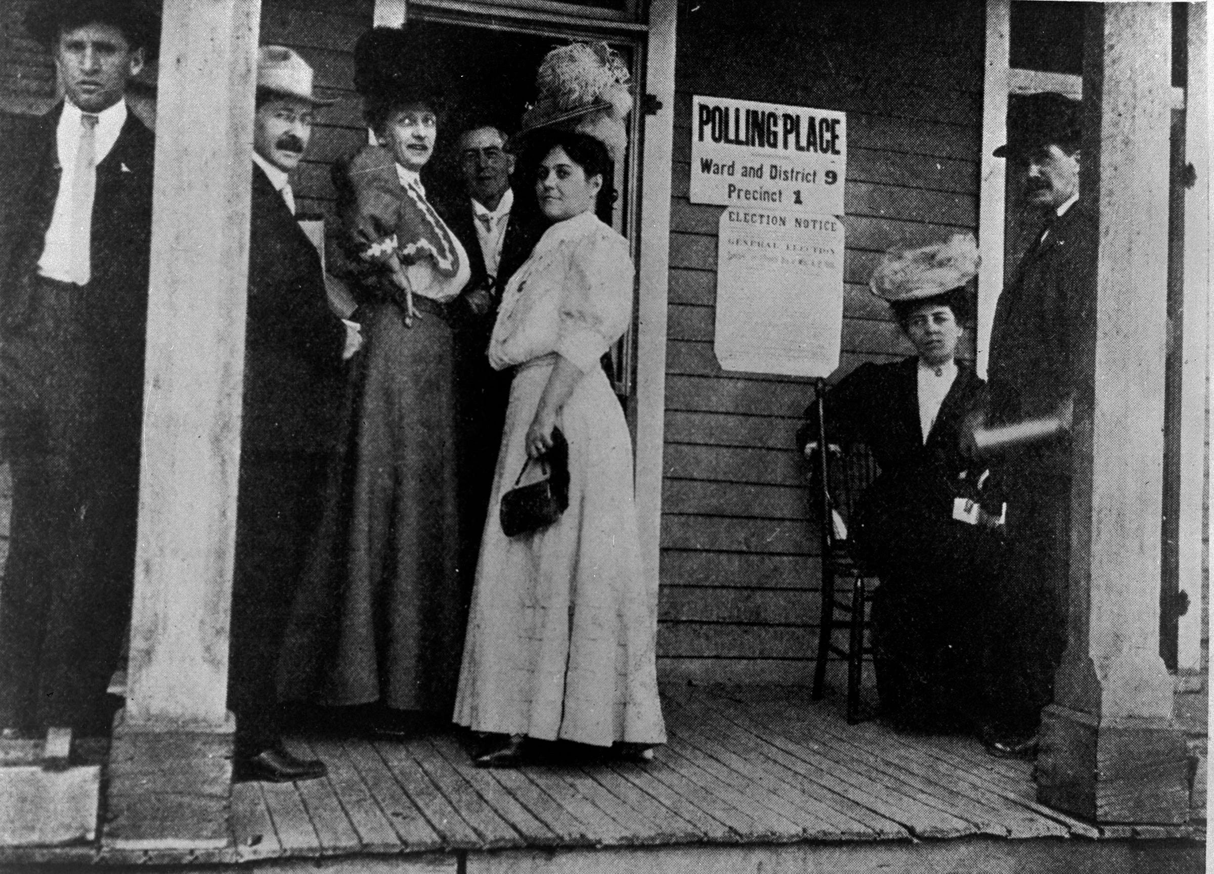 Women stand outside of a Colorado polling place in this undated historic photo.
