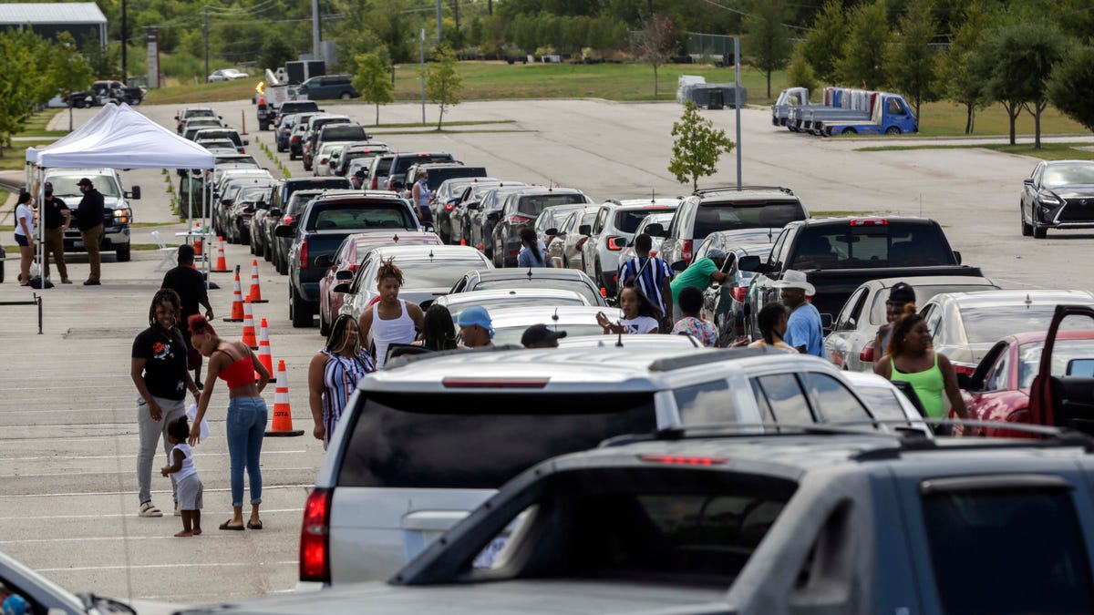 Hundreds of Hurricane Laura evacuees wait in their cars as they line up for hotel vouchers at the Circuit of the Americas in Austin on Wednesday, August 26, 2020. Texans from the pocket of the state expected to be hit hardest by Hurricane Laura waited hours at Circuit of Americas for shelter. The city of Austin said they would provide hotel vouchers for evacuees, however many hotels in the city have filled up forcing hundreds of people to drive from Austin to San   Antonio or Ennis.