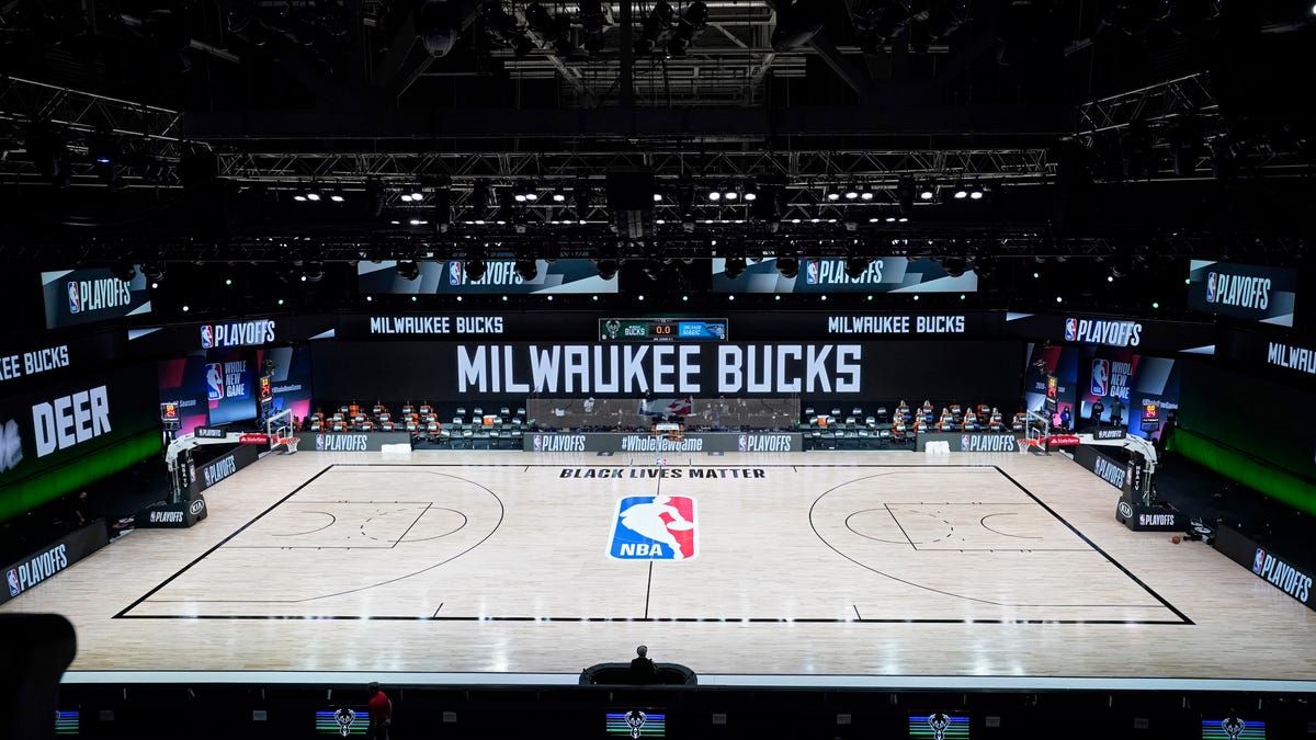 The court and benches are empty at the scheduled start of a playoff game between the Bucks and Magic.
