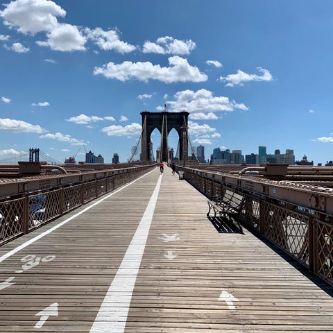 Walking across the Brooklyn Bridge on July 14.