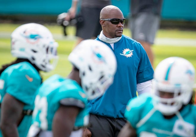 Coach Brian Flores oversees practice Friday at Dolphins training camp in Davie. [ALLEN EYESTONE/PALMBEACHPOST.COM]