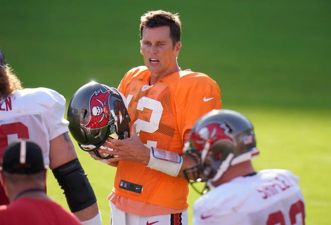 Tampa Bay Buccaneers quarterback Tom Brady (12) during an NFL football training camp practice Friday, Aug. 28, 2020, in Tampa, Fla. (AP Photo/Chris O'Meara)