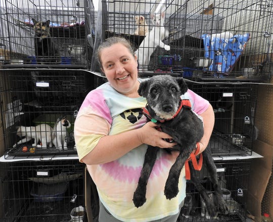 Rachel Selders of the Coshocton County Humane Society with Clyde, one of the few dogs they have for adoption. They mainly deal with cats, which can be seen behind Selders at Tractor Supply Co. The organizations also offers a mobile clinic through Rascal in Columbus and a tran-neuter-release program for feral cats among more.