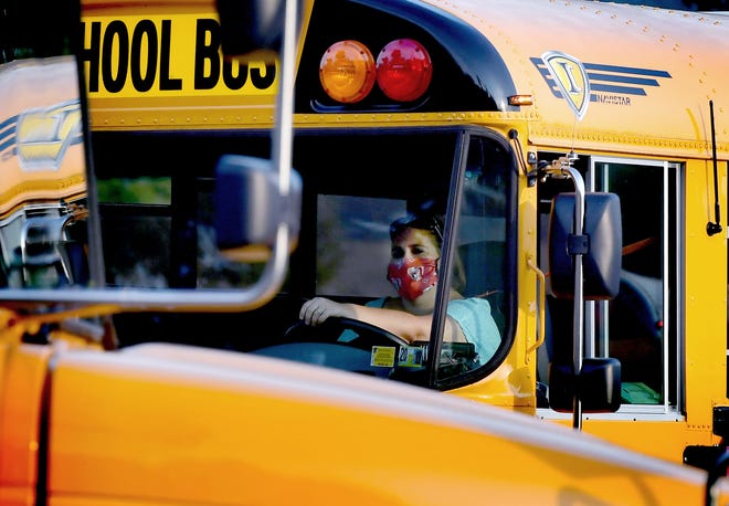 A bus driver exits Central York High School on the first day of classes Friday, August, 28, 2020. The Central School District opted for in-person attendance. Bill Kalina photo 