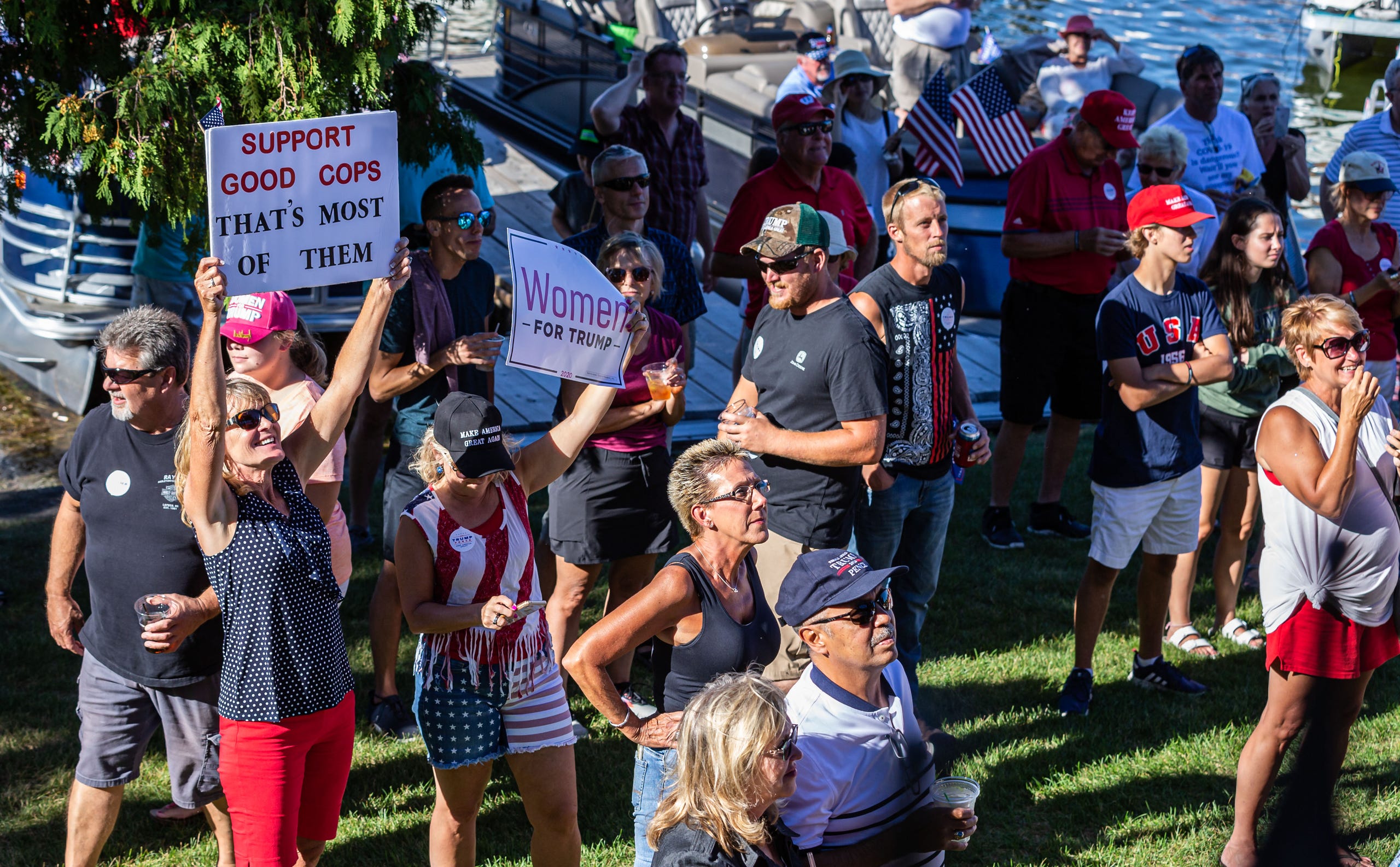 People gather at The Golden Mast restaurant in Okauchee during a boat parade in support of President Trump on Saturday, August 29. The event was hosted by the Republican Party of Waukesha County.