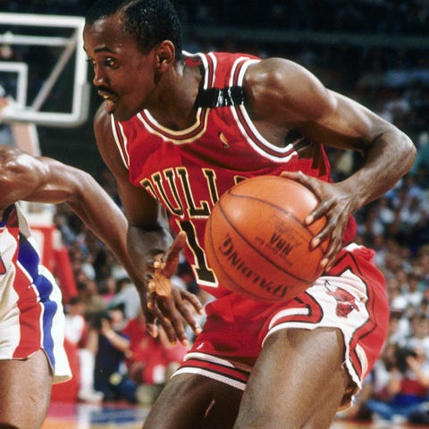 Craig Hodges is defended by Isiah Thomas during a 