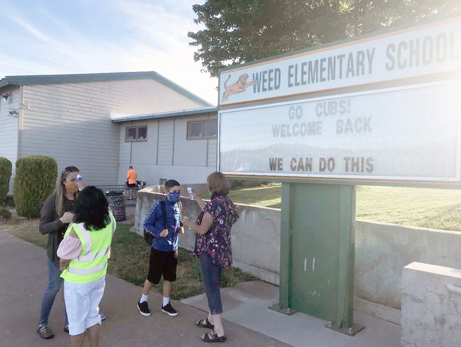 All who enter Weed Elementary School have their temperature checked on the first day, Aug. 31, 2020.