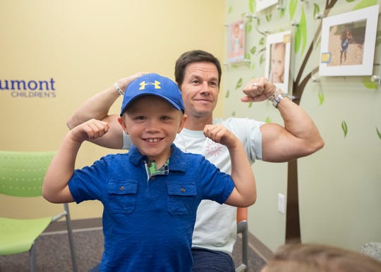 Actor Mark Wahlberg and cancer patient Hudson Brown compared muscles at Royal Oak Beaumont Hospital during a 2019 visit.  Wahlberg also brought Hudson several Transformer toys from Director Michael Bay.  Hudson’s favorite is Bumble Bee.